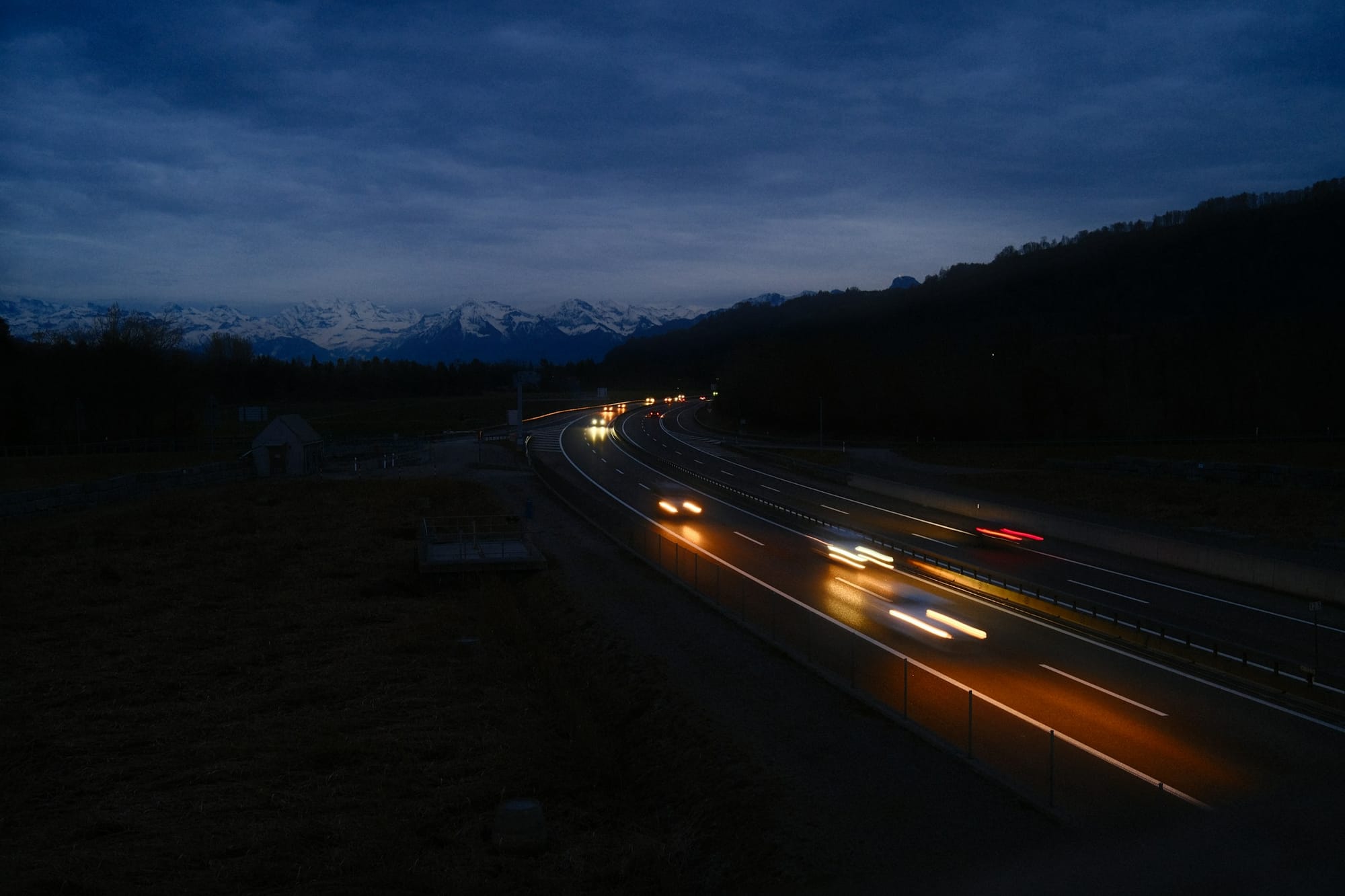 Cars at night along a mountain highway